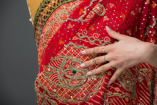 cropped view of indian woman in traditional sari, isolated on grey