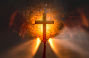 Cross with opening the Bible with light of candle. christian concept.