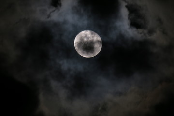 Shiny Moon In Over Black Clouds