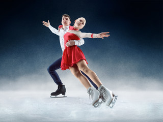 Professional man and woman figure skaters performing show or competition on ice arena © master1305