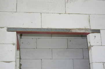 Aerated concrete blocks door way with metal lintel