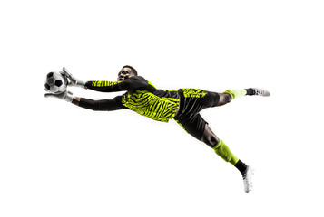 Male soccer player goalkeeper catching ball in jump. Silhouette of fit man with ball isolated on white studio background