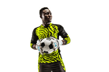 One african male soccer player goalkeeper standing and holding ball. Silhouette isolated on white...