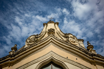 The amazing medieval Church of Madonna dei Martiri in the stunning town of Altamura in the Puglia region, South Italy. Close-up street detail view. Lovely sunny summer day with puffy white clouds