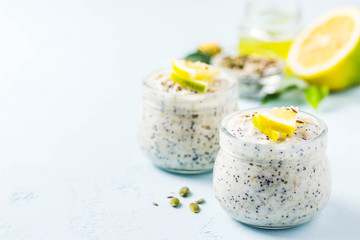 Healthy breakfast, lemon poppy seed overnight oats. Selective focus, space for text.