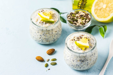 Lemon poppy seed overnight oats in glass jars. Selective focus, space for text.