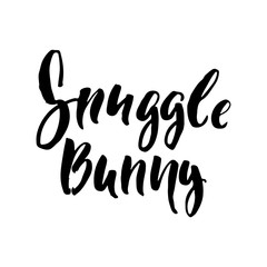 Snuggle bunny - Easter hand drawn lettering calligraphy phrase isolated on white background. Fun brush ink vector illustration for banners, greeting card, poster design, photo overlays.