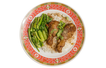 Stewed chicken or Braised chicken with Chinese kale and rice in dish on wooden table.