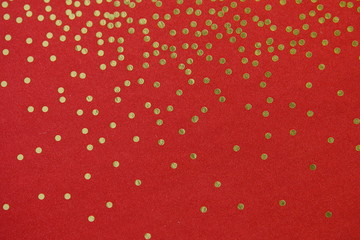 gold dots on red background