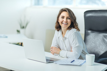 Young woman in office working