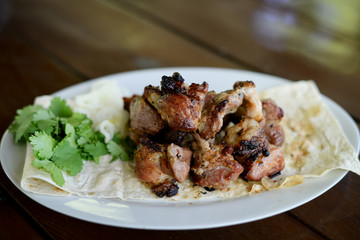 roasted meat on a grill in pita bread, shish kebab, close-up.