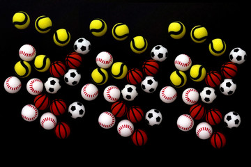 Balls basketball, football, baseball and tennis background. Top view.
