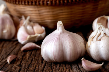   group of garlic on kitchen wooden table