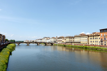 Obraz premium Bridge across the Arno River, Florence, Italy with palazzos lining the bank
