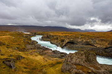 Obraz premium Iceland. View landscape with mountain river. Warm sunny summer day