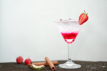 Strawberry martini drink on wooden 