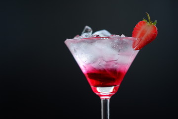 Strawberry martini drink on wooden 