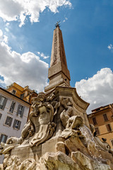 Fototapeta na wymiar Fountain on Piazza della Rotonda with Parthenon behind on a bright morning in Rome, 