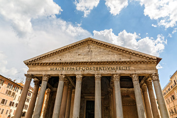 Naklejka premium Italy Europe ancient roman pantheon temple front view at classical columns portico colonnade with surrounding historic rome buildings 