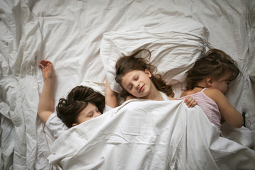 funny kids wake up and swim,top view. Real room