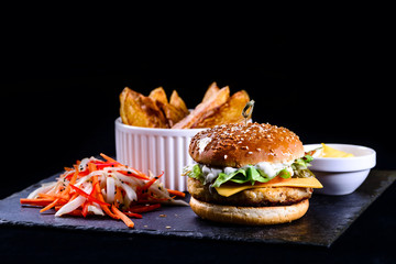 homemade burger, salad and potatoes - fast food set