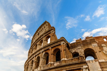 Fototapeta premium Rome/ Italy July 2018: Colosseum in Rome, Italy. Ancient Roman Colosseum is one of the main tourist attractions in Europe. Scenic view of Colosseum ruins in summer.