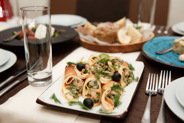Served table. Pancakes with salmon