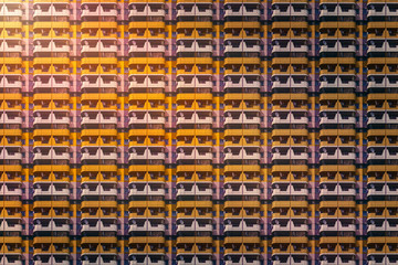 architectural pattern, facade with yellow balconies of a skyscraper