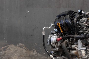 closeup car engine repair in garage with soft-focus and over light in the background