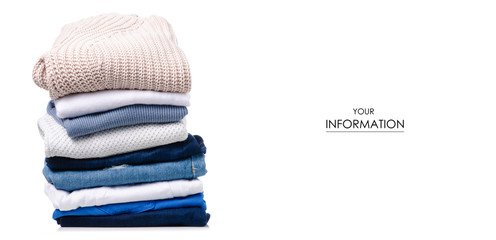 Stack of clothing jeans sweaters pattern on a white background isolation