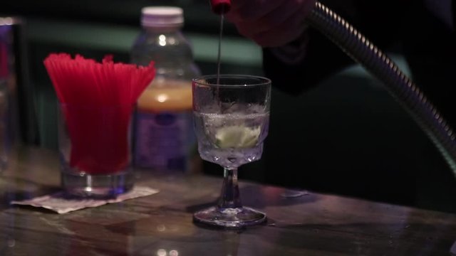 Making cocktail with fountain gun lime straw