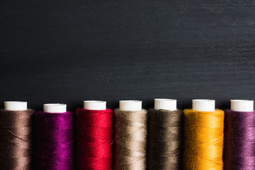 Color sewing threads close-up shot. Selective focus. Shallow depth of field.