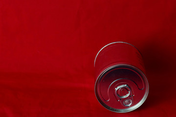 close up milk cans rolling in red background