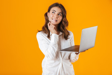 Portrait of a cheerful young woman wearing white shirt