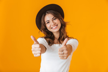 Portrait of a cheerful young woman wearing white shirt