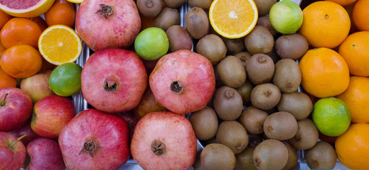 Shelf with ripe fruits. Assorted for fresh juices. Farmer's market.