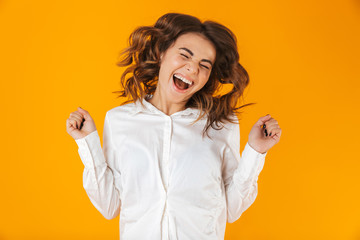 Portrait of a cheerful young woman wearing white shirt