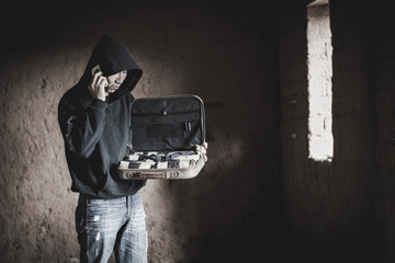 Man call up sells the drugs on phone, drug trafficking, crime, addiction and sale concept.
