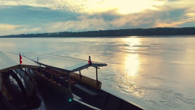 Pirogues docked at Madre De Dios river inside the Amazon rainforest of Peru at Puerto Maldonado.