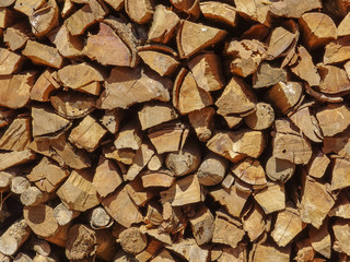 Rural dry wood branch firewood stack prepare for burning on winter season.
