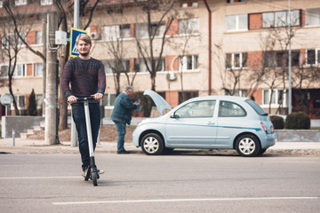 conventional vehicle vs electric vehicle millennials culture riding electric scooter for outdoor...