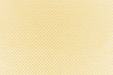 Luxury gold textile background. Silk cloth texture. Fabric pattern.