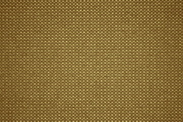 Luxury gold textile background. Silk cloth texture. Fabric pattern.