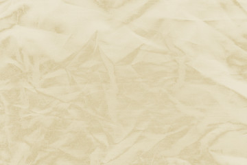 Luxury gold textile background. Silk cloth texture. Fabric pattern.