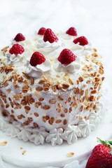 Homemade White forest cake with strawberries and granola topping