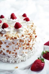 Homemade White forest cake with strawberries and granola topping