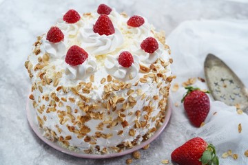 Homemade White forest cake with strawberries and granola topping