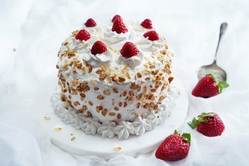 Homemade White forest cake with strawberries and granola topping