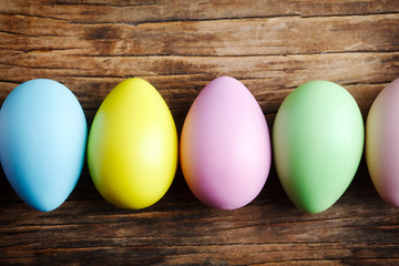 Easter eggs decoration on wooden background.