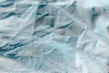 Ocean blue textile background. Silk cloth texture. Fabric pattern.